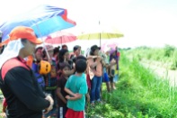 Residents of Tanglaw, Dujali, Davao del Norte invoke divine intervention before the start of the search and retrieval operation to find 22-year old Ben Banhaw, who disappeared while salvaging driftwoods at the Panaga River. noel baguio/davnor pio