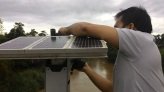 A staff of the Provincial Disaster Risk Reduction Management Division conducts maintenance on the Water Level Monitoring System (WLMS) with Automatic Rain Gauge (ARG) installed at Mahayahay (Lawang) Bridge, Cambanogoy, Asuncion. PDRRM